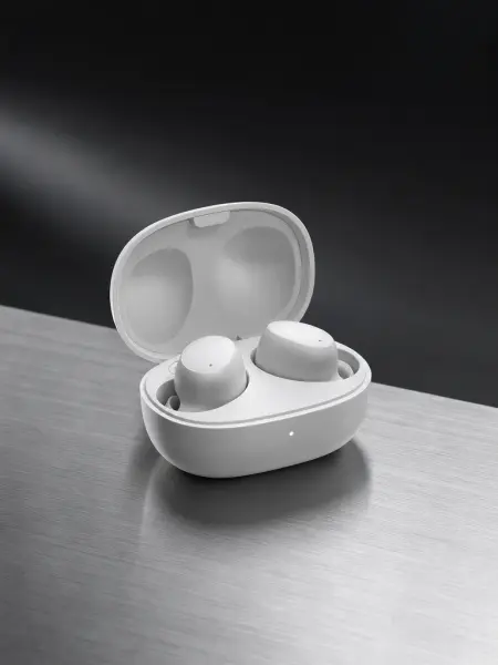White wireless earbuds in an open case